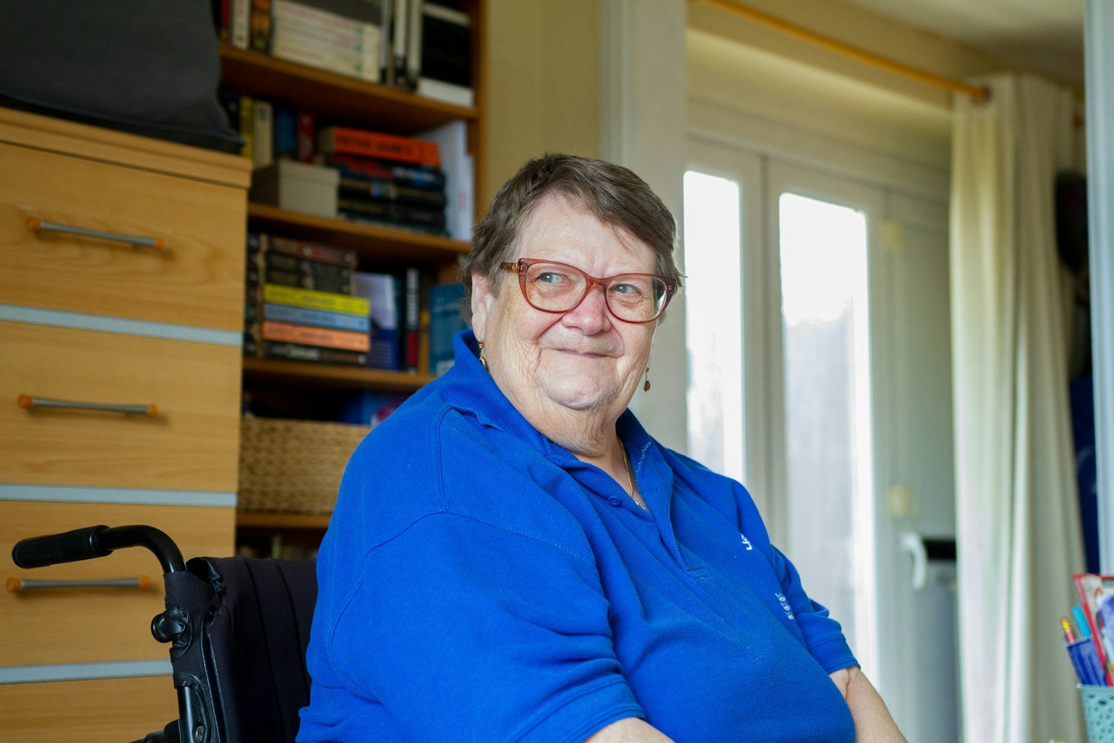 Resident in a wheelchair in a comfortable home setting